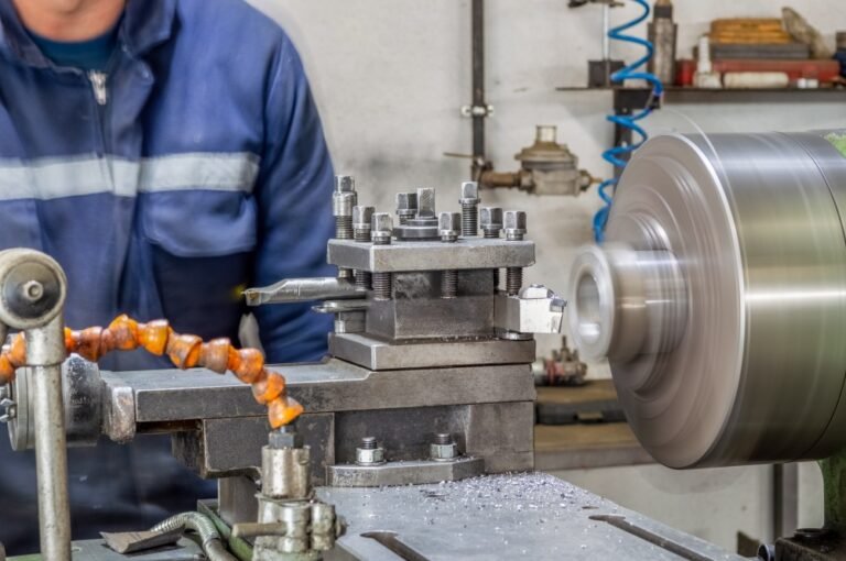 blue-collar-machine-operator-working-with-lathe-ma-2025-01-24-19-59-41-utc
