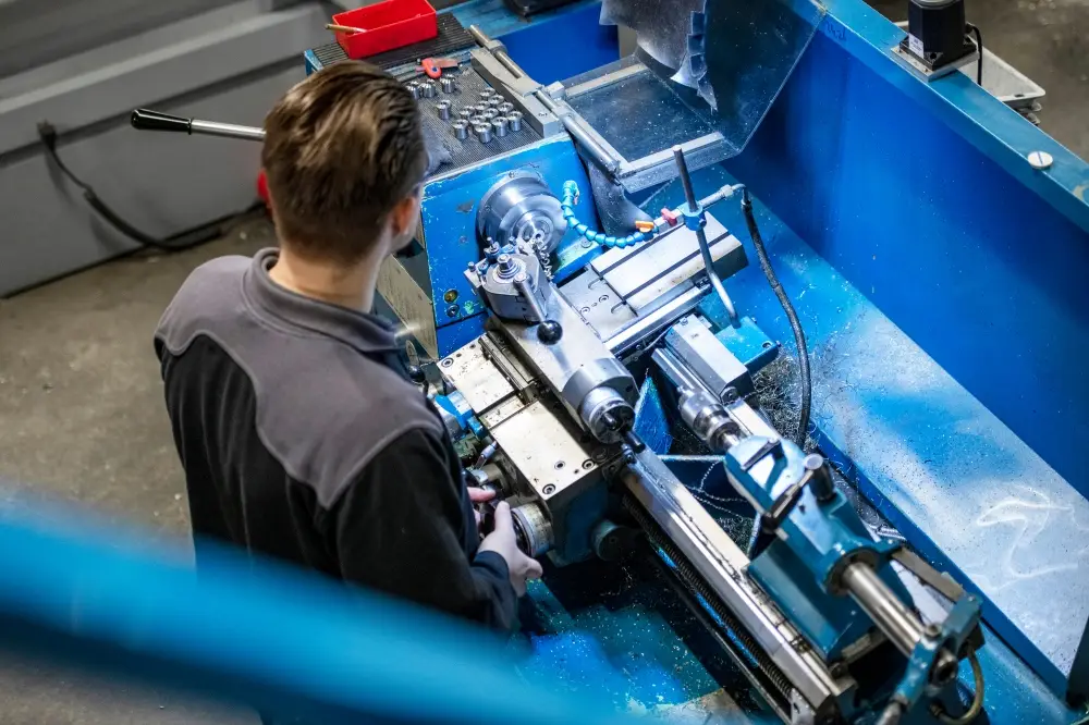 young-mechanical-engineer-working-on-steel-machine-2025-04-03-19-46-49-utc